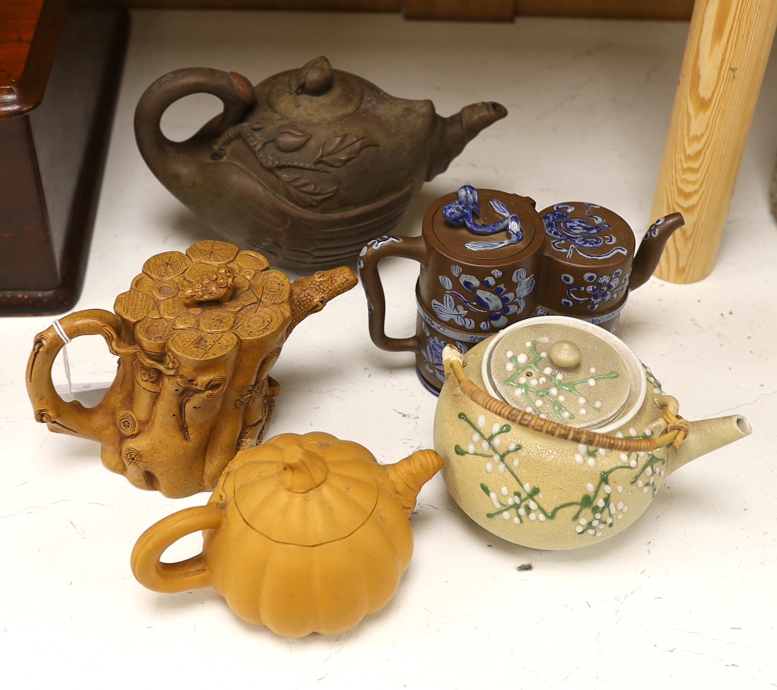 Four Chinese Yixing teapots and a Japanese sharkskin glazed teapot. Provenance - from a collection of Yixing pottery bought in 1990s and early 2000s.